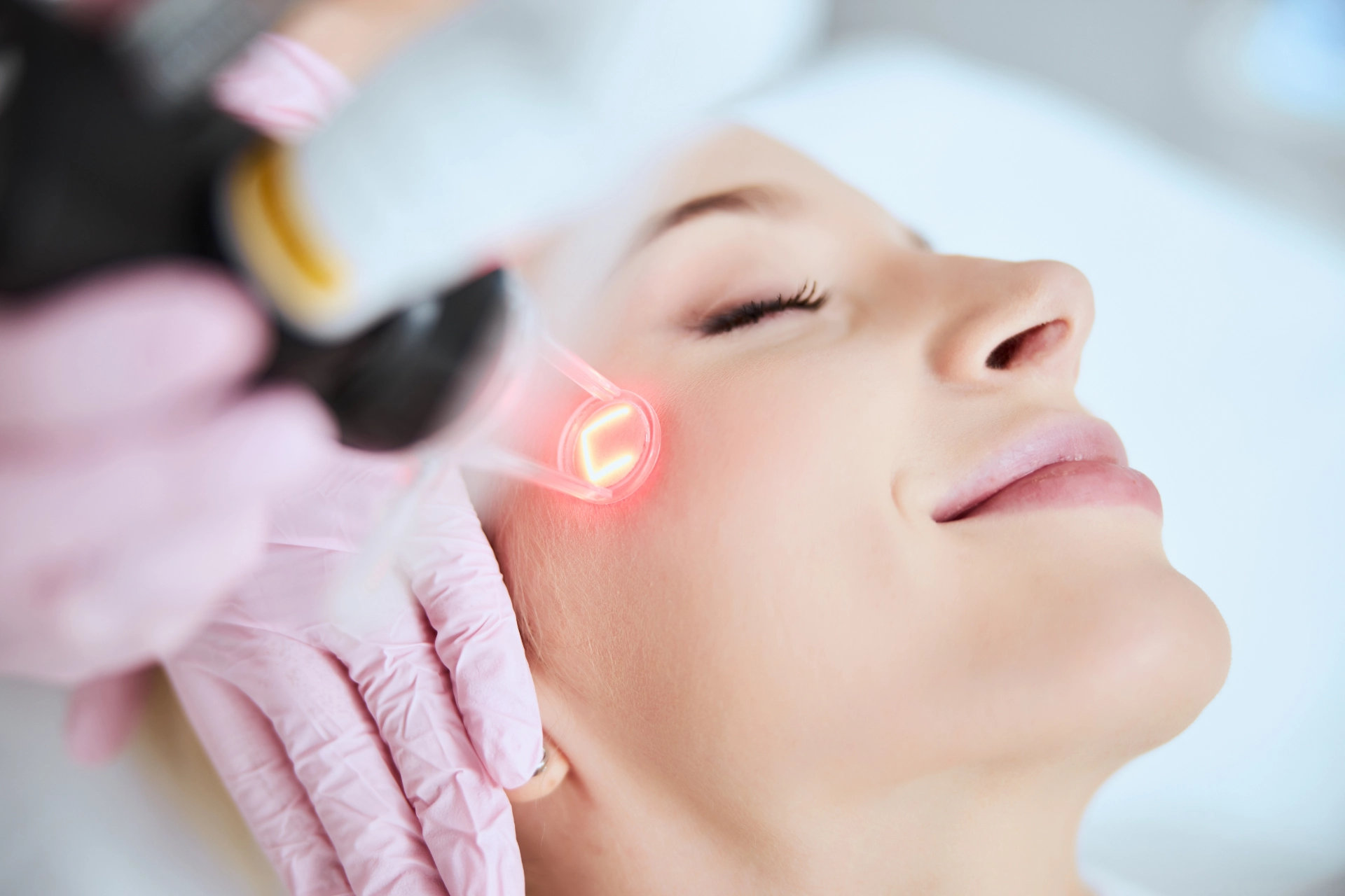 woman getting laser treatment on face